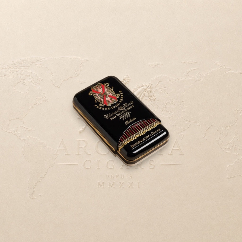 Arcadia Cigars Arturo Fuente Opus X Robusto cigar tin, black with gold lettering and red accents.