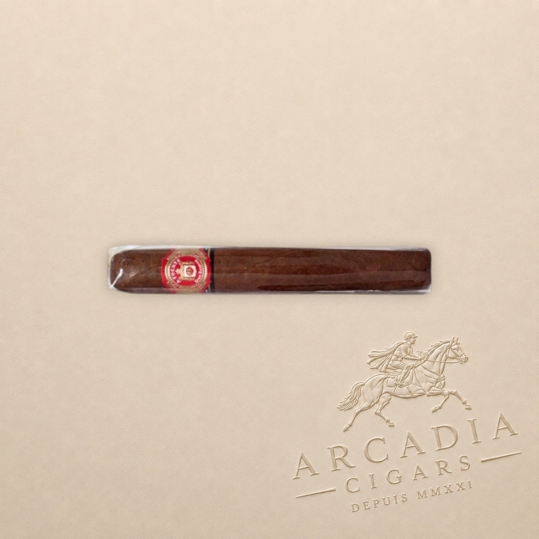 Arcadia Cigars Arturo Fuente Don Carlos Double Robusto cigar with an African Cameroon wrapper on a beige background.