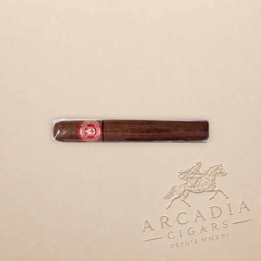 Arcadia Cigars Arturo Fuente Don Carlos Double Robusto cigar with an African Cameroon wrapper on a beige background.