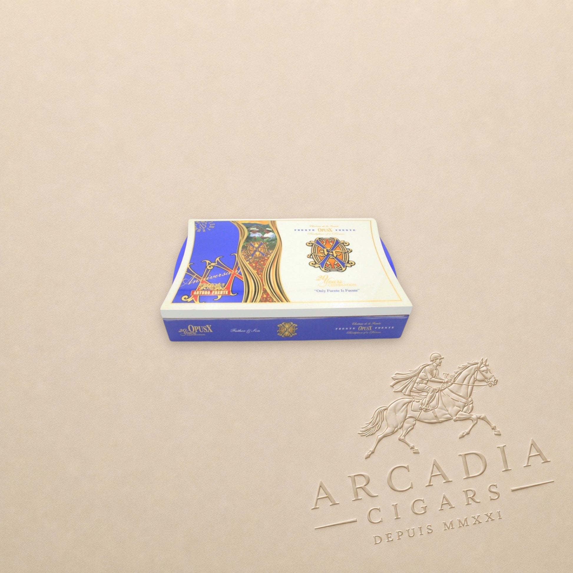 Arcadia Cigars Arturo Fuente OpusX 20 Years Celebration Father and Son cigar box with blue and gold ornate branding.