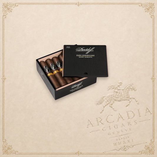 Arcadia Cigars Davidoff Puro Dominicano Short Robusto cigars in an open black wooden box on a neutral background