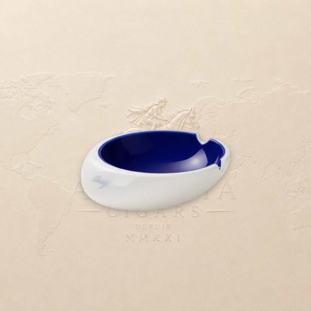 Arcadia Cigars Davidoff Royal Release blue porcelain ashtray with gold insignia and four rests.
