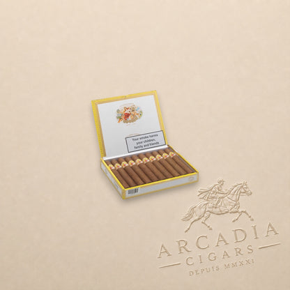 Arcadia Cigars La Gloria Cubana Turquinos 2018 cigars in an open yellow presentation box on a beige background.