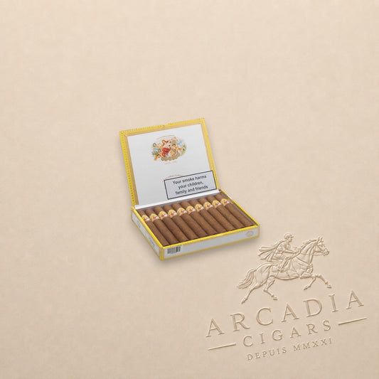 Arcadia Cigars La Gloria Cubana Turquinos 2018 cigars in an open yellow presentation box on a beige background.